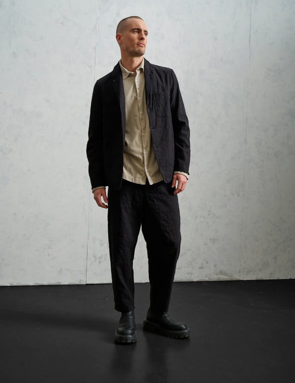 Transit Loose-fit tobi trousers in mottled pinstriped cotton blend with hand embroidery on the back pocket