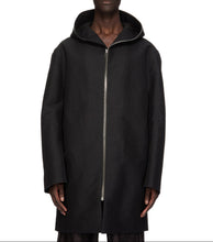 Man wearing a black hooded coat on a white background